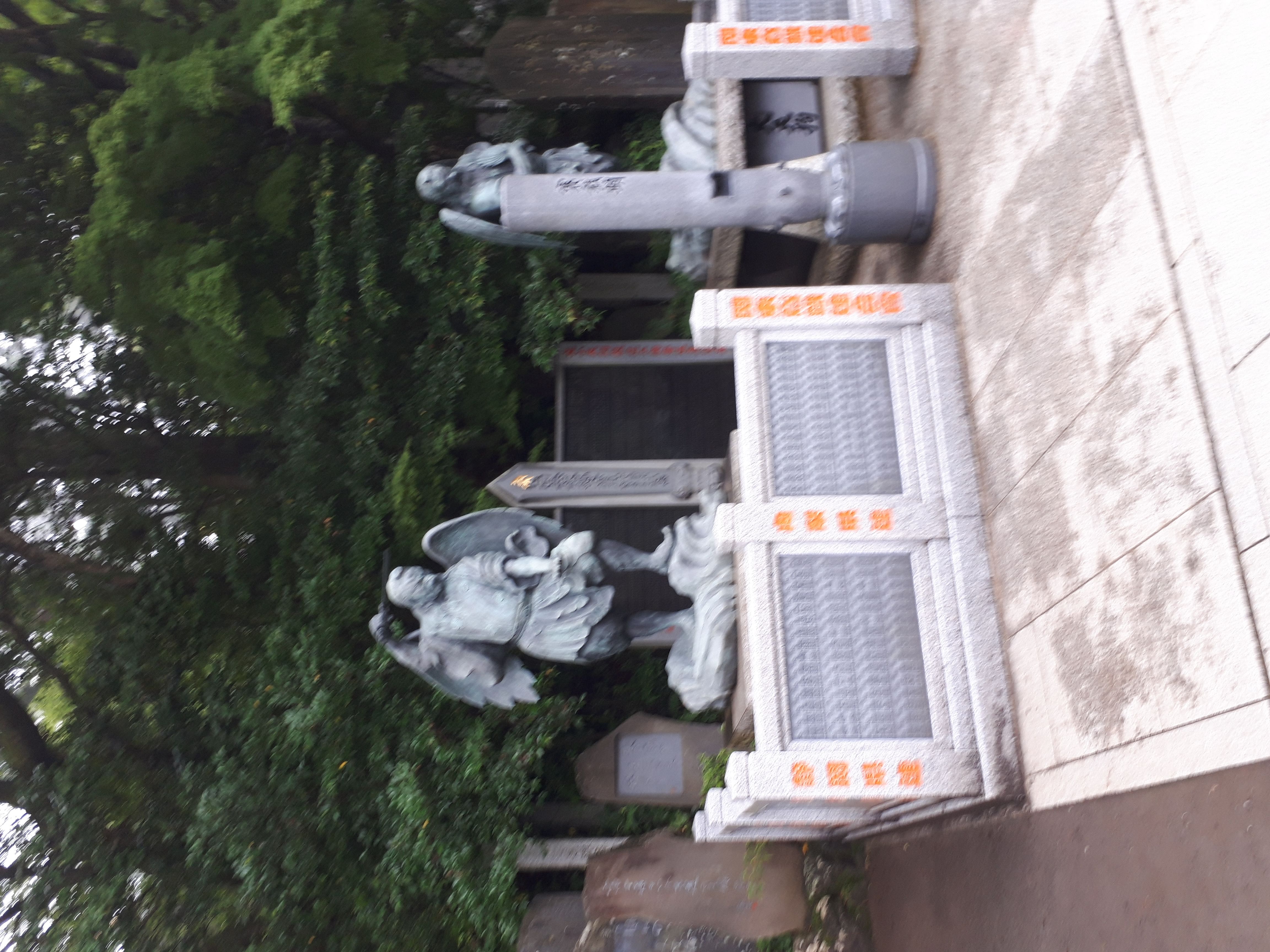 Tengu statue with wings and sword