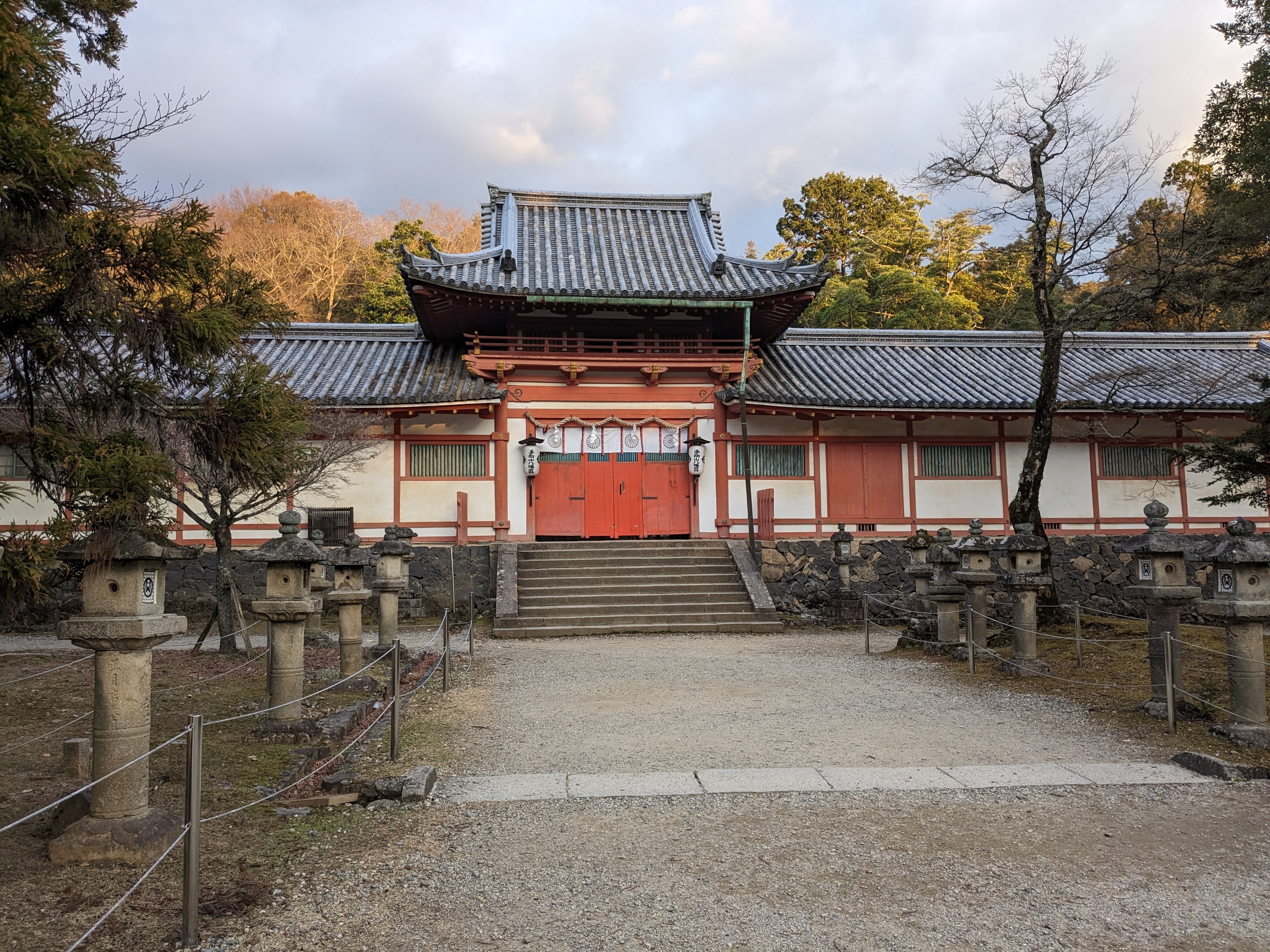 Shrine gate with stone lanterns